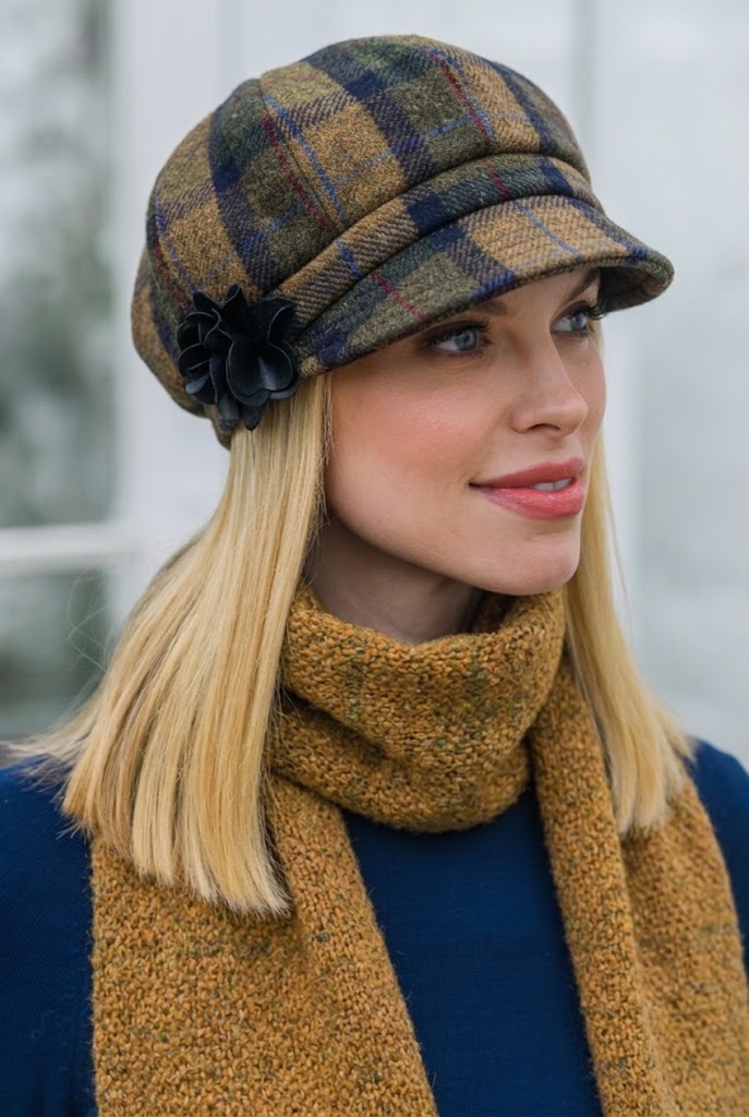 Woman wearing a Mucros Weavers tweed newsboy hat and scarf